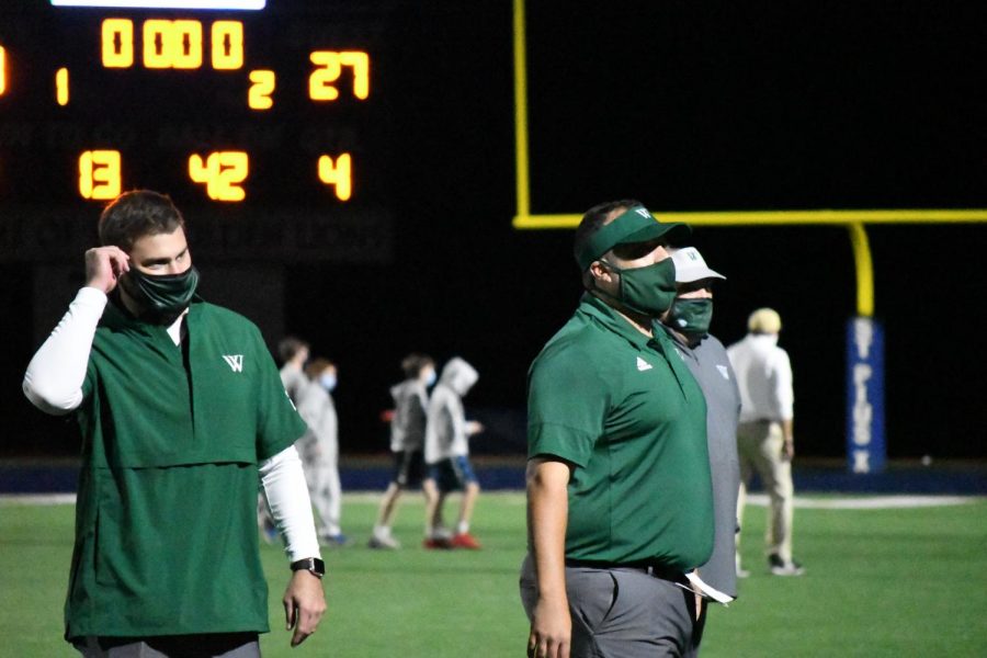 Westminster coaches get their game faces on in preparation for some Friday night football against St. Pius.  Photo courtesy Kelly Weselman.
