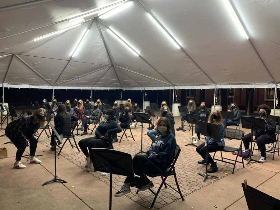 WAC hosts an evening rehearsal, socially distant, in the tent on Love Patio.