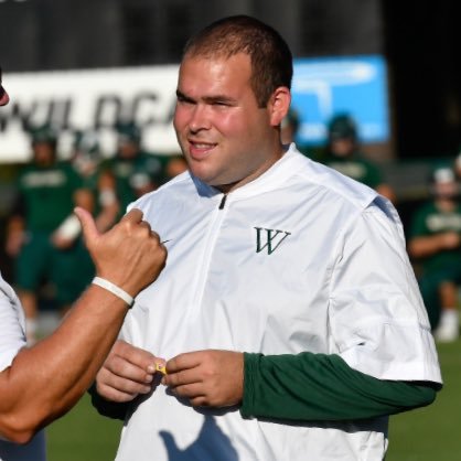 Pullen leads football team on the field.