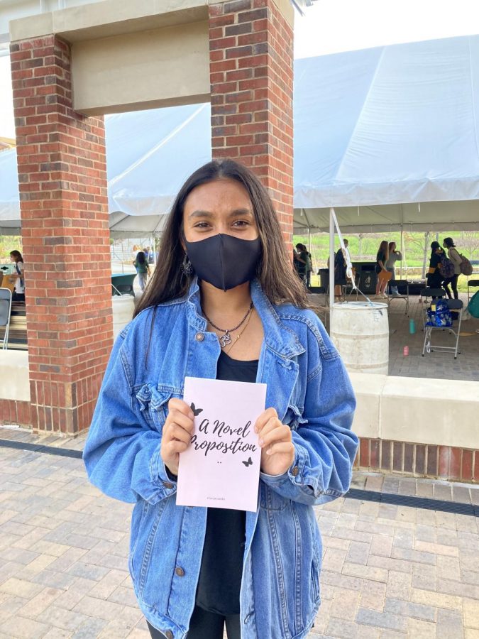 Riya Jayanthi, a senior at Westminster, holds her recently published book.