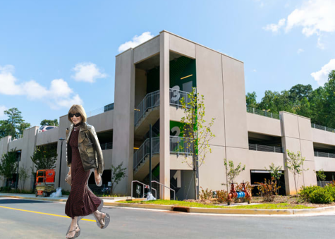 Wintour poses in front of newly constructed parking deck.