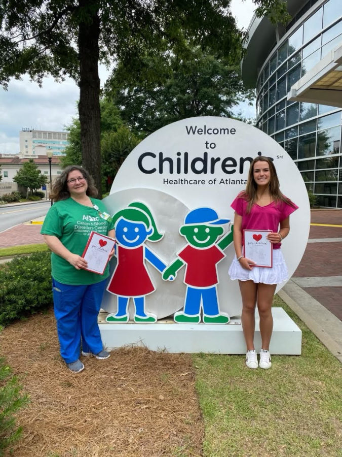 Head of HeART for Charity, Katherine Andrews, helps out at the Children’s
Healthcare of Atlanta
