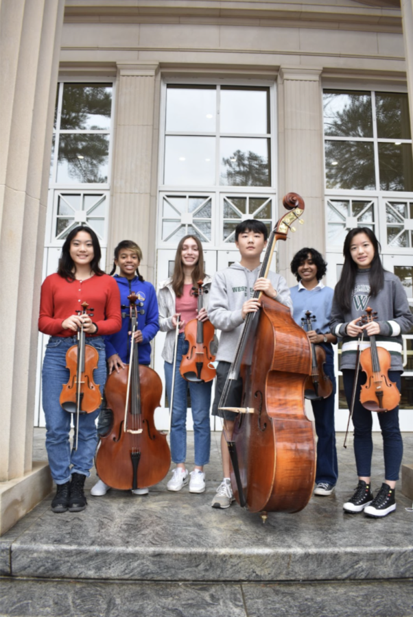 Selected+All-state+orchestra+students+stand+in+front+of+Pressly+Hall.+