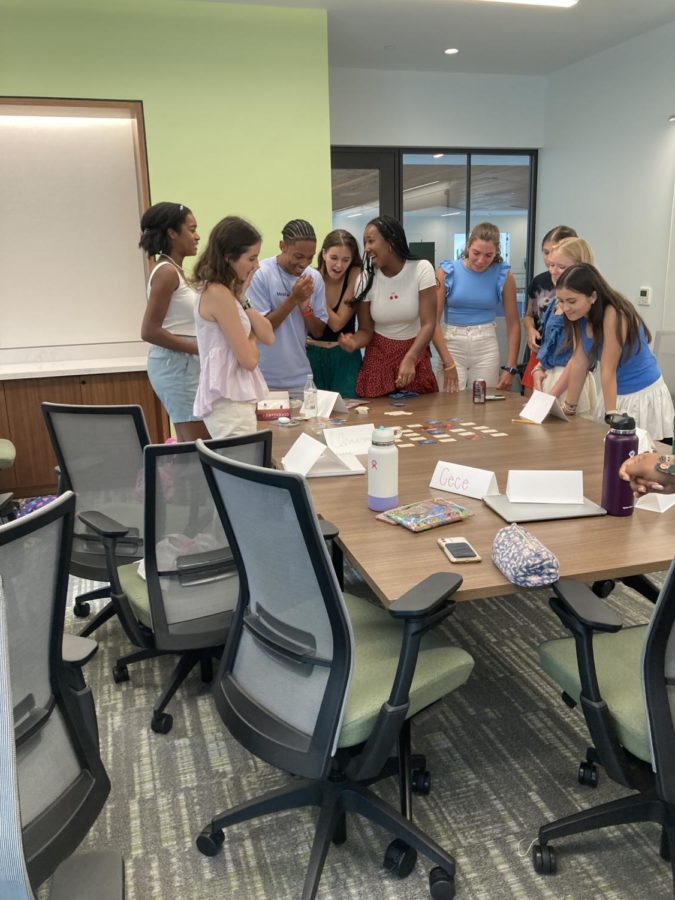 Seniors Lauren James and Christian Flournoy lead a group activity for the Civil Dialogue Fellows.