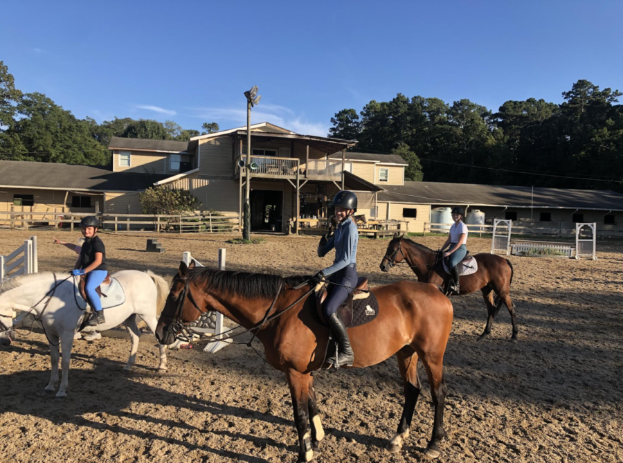 The equestrian team enjoys an afternoon practice at Falcon Ridge Stables. 
(Photo credit to team member Josie Anderson)
