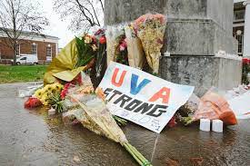 Flowers and candles were placed around the UVA Campus to mourn the losses of the students.
(Credit to New York Times)