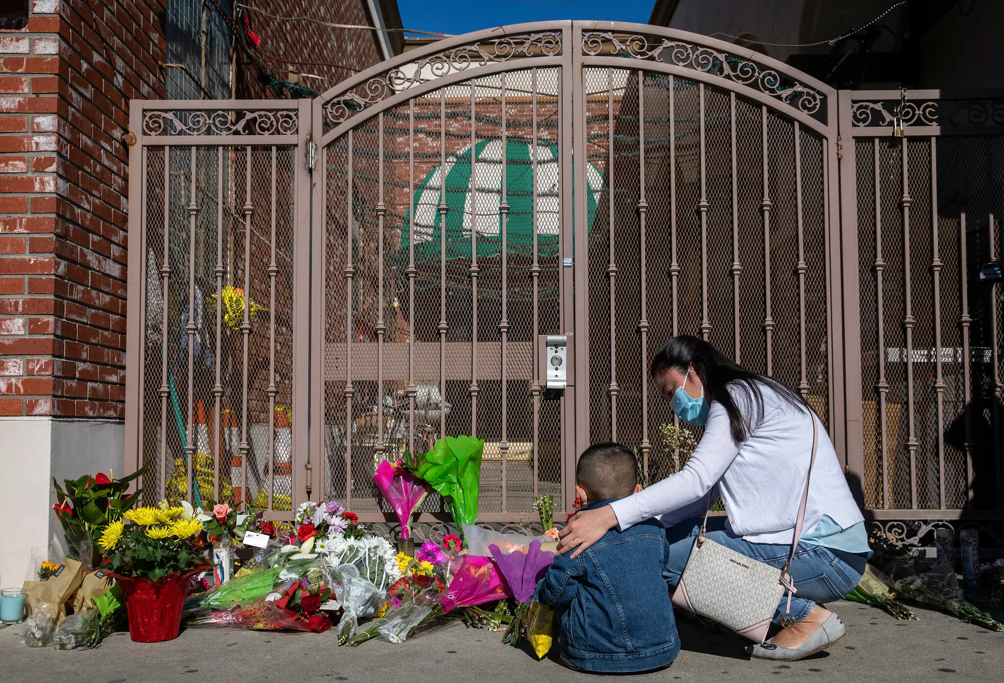 A memorial was set up outside Star Ballroom Dance Studio to honor the eleven people who died in the Monterey Shooting (Credit to New York Times)