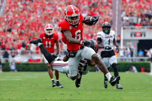 Dominic Lovett #6 of the Georgia Bulldogs is tackled by Nick Emmanwori #21 of the South Carolina Gamecocks during the third quarter at Sanford Stadium on September 16, 2023, in Athens, Georgia. 

Credit: Photo by Todd Kirkland

