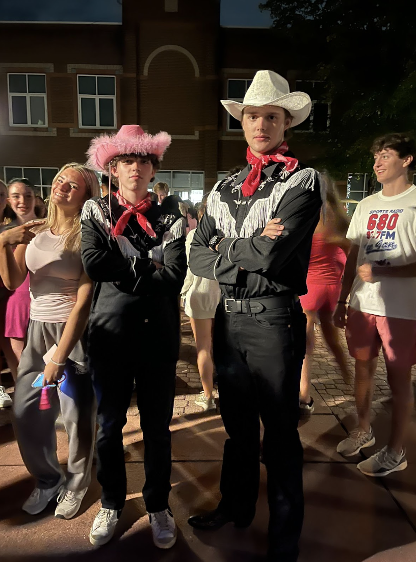 Two students dressing up according to the homecoming theme: Barbenheimer.