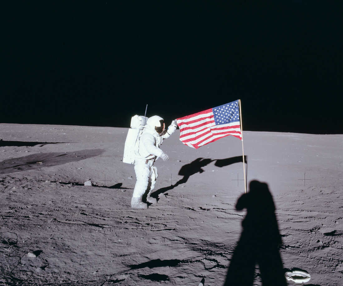From+NASA%3A%C2%A0Apollo+12+commander+Charles+Conrad+unfurls+the+United+States+flag+on+the+lunar+surface+during+the+first+extravehicular+activity+on+Nov.+19%2C+1969.